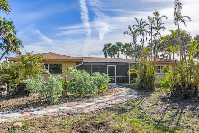 back of house with a sunroom