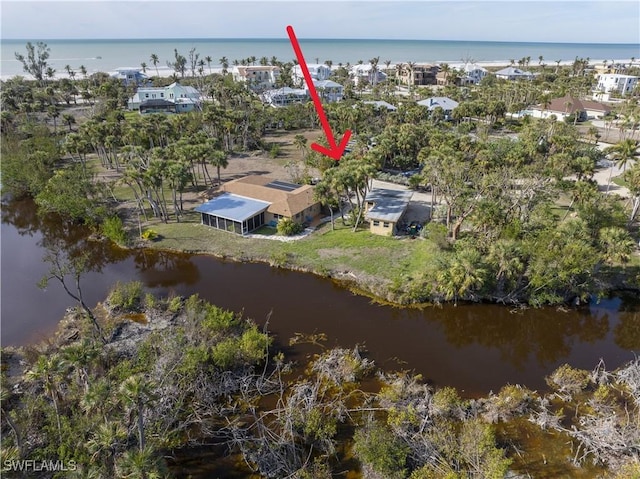 birds eye view of property featuring a water view