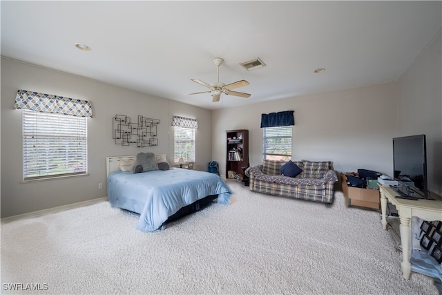 carpeted bedroom with ceiling fan