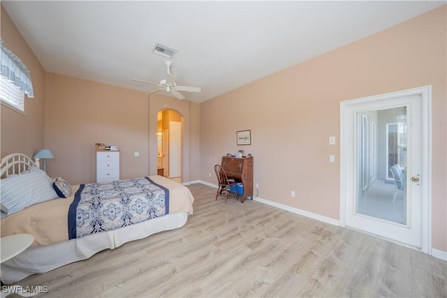 unfurnished bedroom featuring ceiling fan, light wood-type flooring, and access to outside