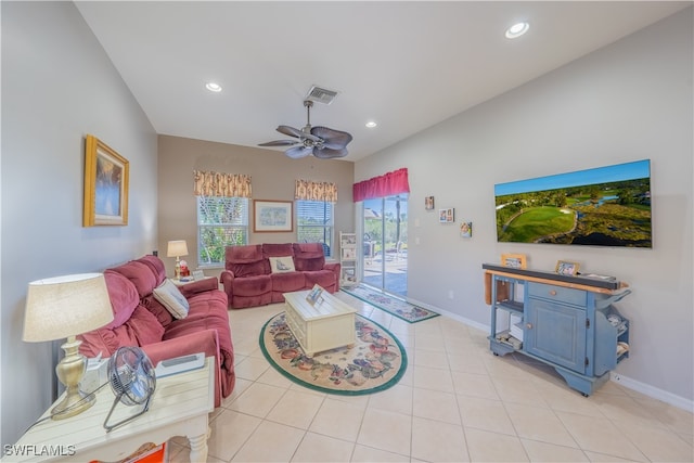 living room featuring ceiling fan and light tile patterned flooring