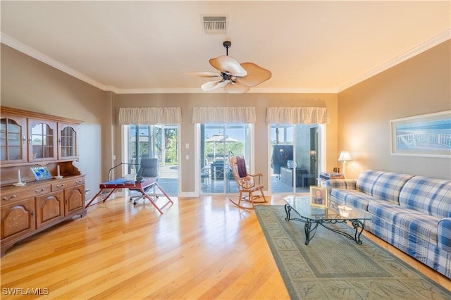 living room featuring ceiling fan, light hardwood / wood-style flooring, and ornamental molding