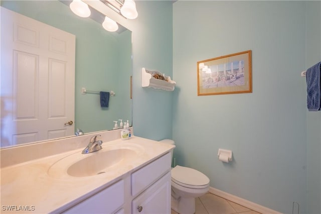 bathroom featuring tile patterned floors, vanity, and toilet