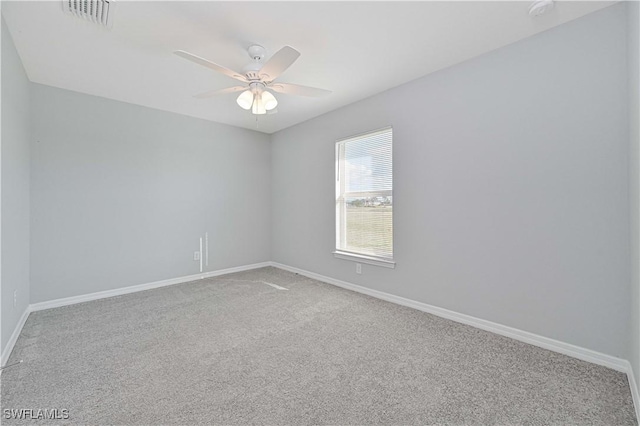 empty room featuring carpet flooring and ceiling fan