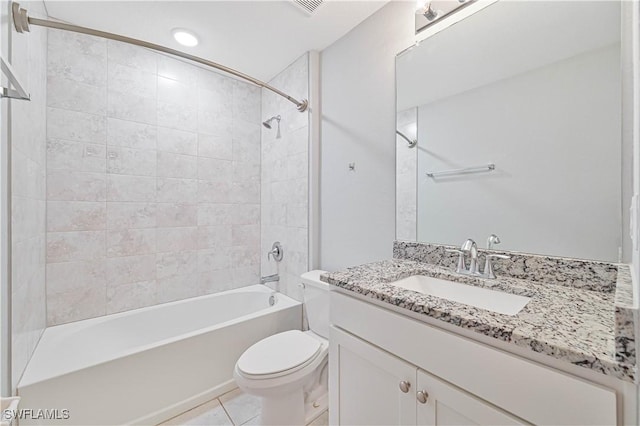 full bathroom with tile patterned floors, vanity, toilet, and tiled shower / bath combo