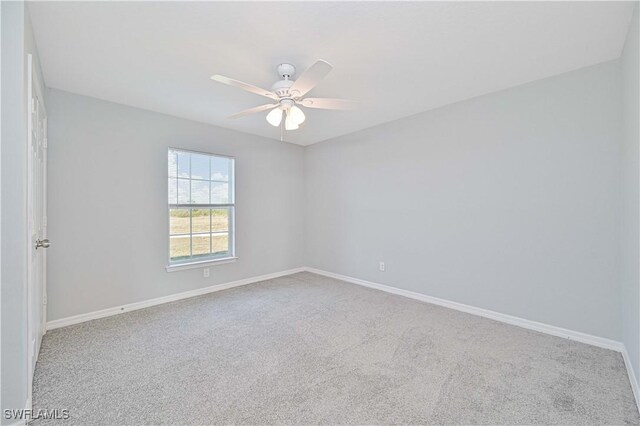 spare room with ceiling fan and carpet floors