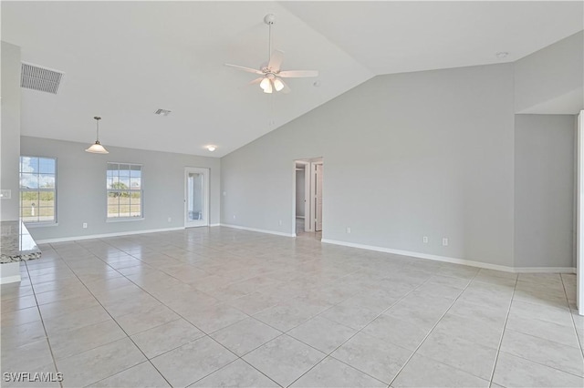 empty room featuring light tile patterned flooring, high vaulted ceiling, and ceiling fan