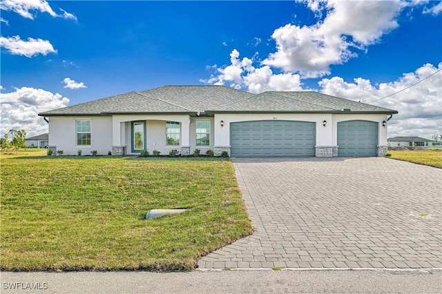 view of front of house with a garage and a front yard