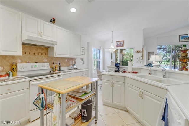 kitchen with sink, white appliances, white cabinetry, hanging light fixtures, and light tile patterned floors