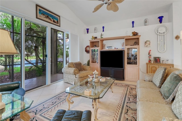 tiled living room with vaulted ceiling and ceiling fan