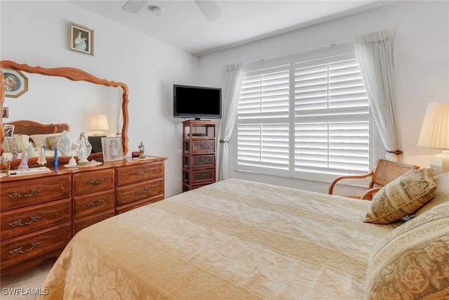 bedroom with ceiling fan and carpet floors