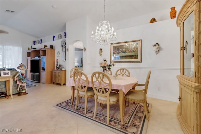 tiled dining room featuring vaulted ceiling