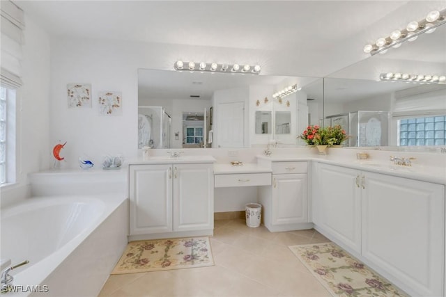 bathroom featuring plus walk in shower, tile patterned flooring, and vanity