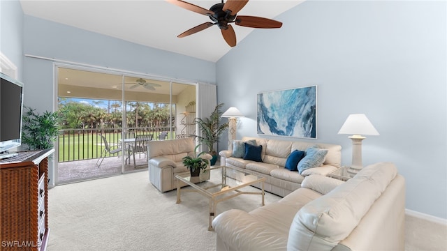 carpeted living room with high vaulted ceiling and ceiling fan