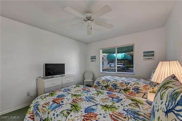 bedroom with ceiling fan and carpet floors