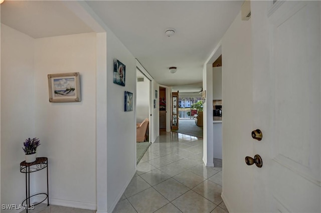 hallway with light tile patterned floors