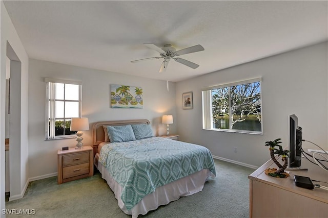 bedroom featuring ceiling fan and light colored carpet