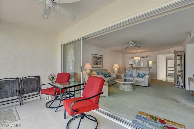 interior space with an outdoor living space and ceiling fan