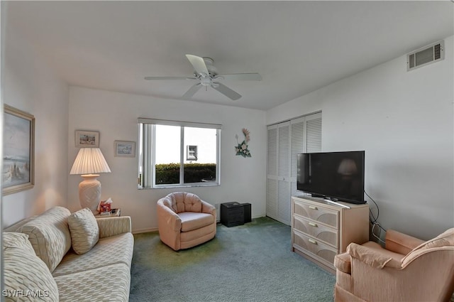 carpeted living room featuring ceiling fan