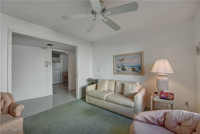 tiled living room featuring ceiling fan