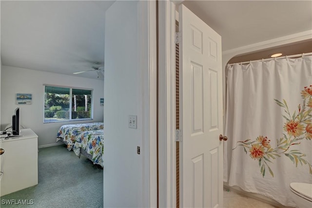 carpeted bedroom with ceiling fan