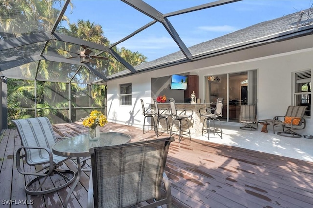 sunroom / solarium with ceiling fan