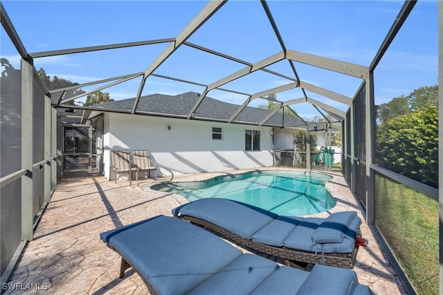 view of pool with a lanai and a patio