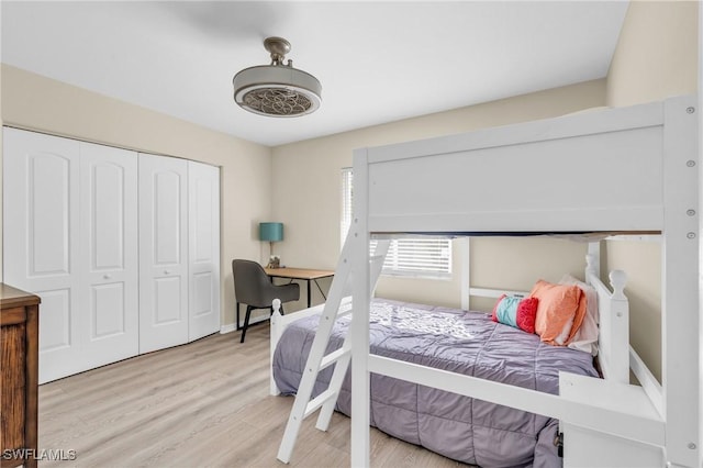 bedroom featuring light hardwood / wood-style floors and a closet