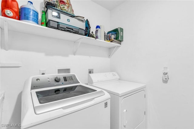 laundry area with washer and clothes dryer