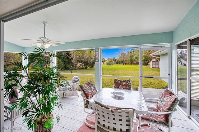 sunroom / solarium with a wealth of natural light and ceiling fan