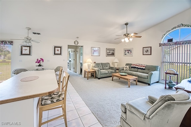 living room featuring light carpet, vaulted ceiling, and ceiling fan