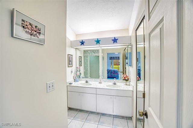 bathroom featuring tile patterned flooring and vanity