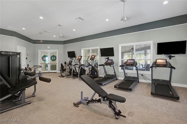 gym with french doors and light carpet