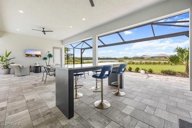 view of patio / terrace with glass enclosure and ceiling fan