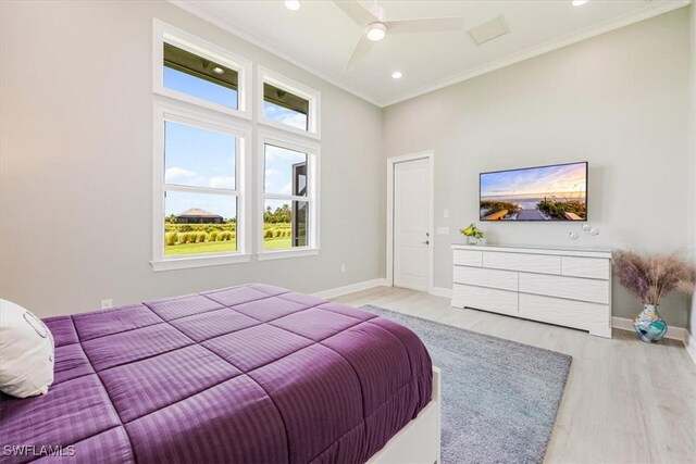 bedroom with ceiling fan, light hardwood / wood-style floors, and ornamental molding