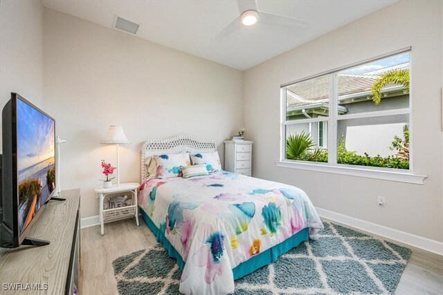 bedroom featuring ceiling fan and light hardwood / wood-style flooring