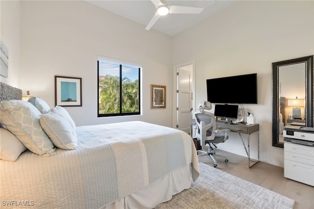 bedroom featuring ceiling fan and light hardwood / wood-style flooring