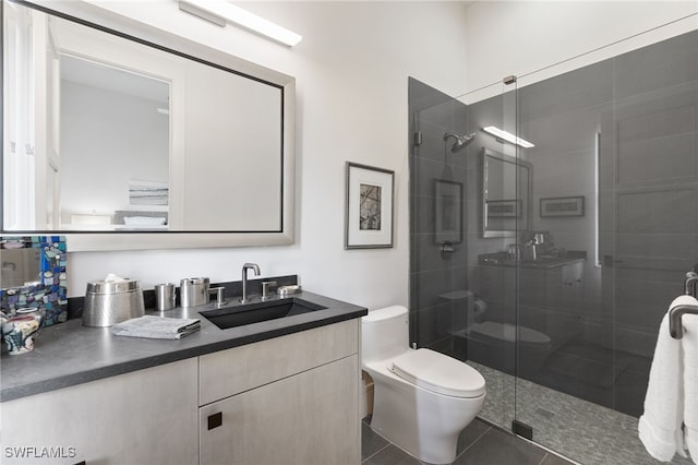 bathroom featuring vanity, toilet, tile patterned flooring, and an enclosed shower