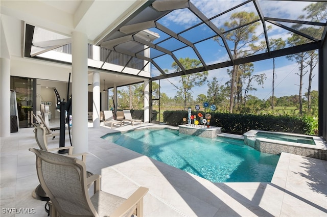 view of swimming pool featuring a lanai, a patio area, and an in ground hot tub