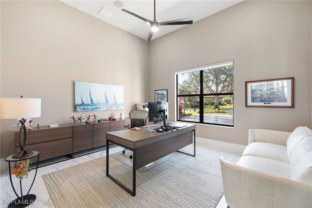 office featuring ceiling fan and high vaulted ceiling