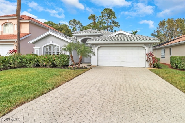 mediterranean / spanish-style house featuring a front yard