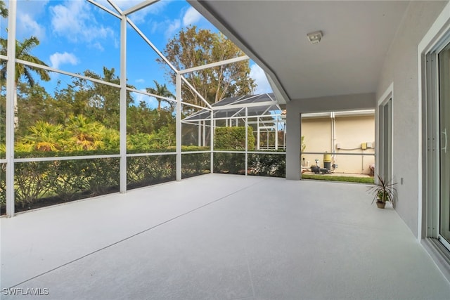 view of patio / terrace featuring a lanai