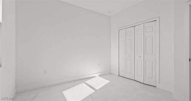 unfurnished bedroom featuring a closet