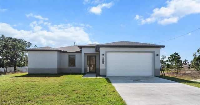 view of front facade featuring a front yard and a garage