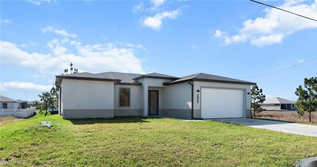 view of front facade with a front yard and a garage