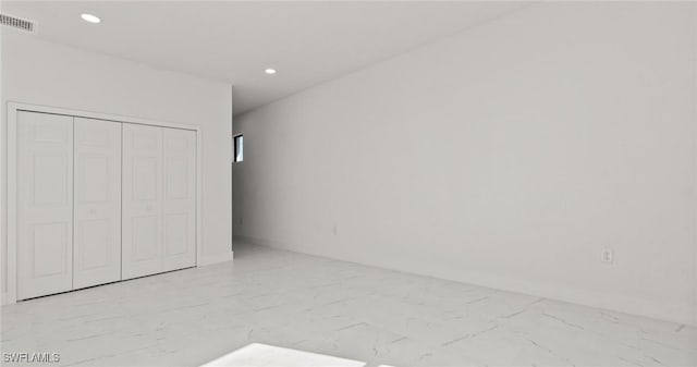 unfurnished bedroom featuring a closet