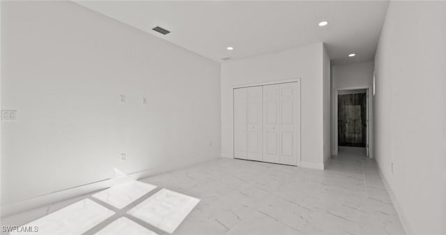 unfurnished bedroom with a closet