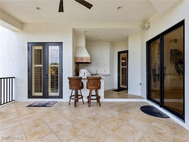 view of patio / terrace featuring area for grilling and ceiling fan