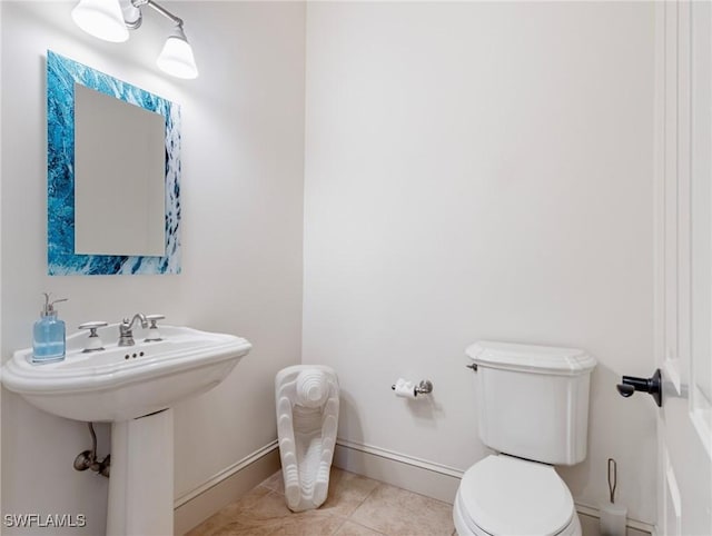 bathroom with tile patterned floors and toilet