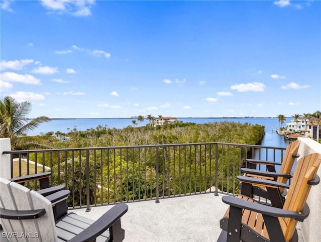 balcony featuring a water view